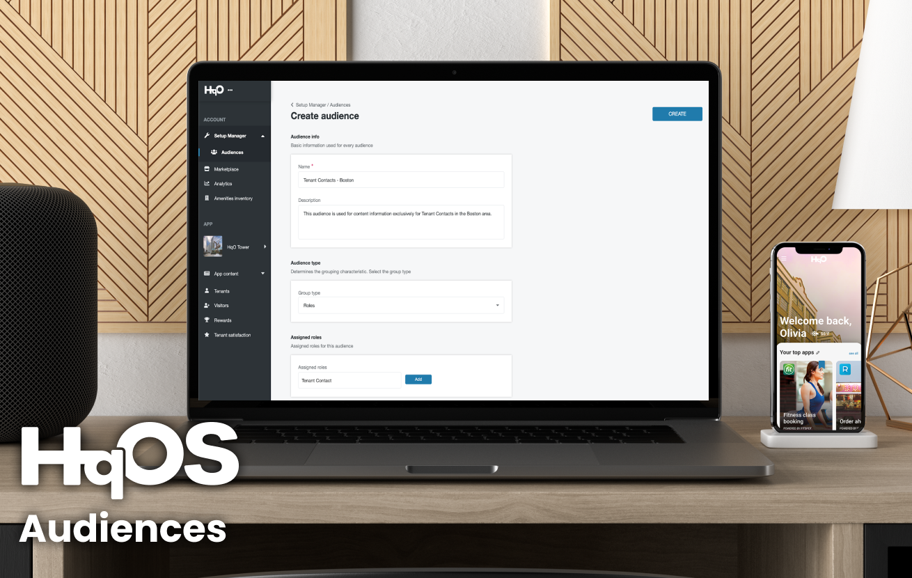 HqO Audience: Introducing the newest product from HqO. This is a picture of a laptop computer and a smart phone, both sitting on a desk and turned on. The laptop shows HqO's Audiences directory, while the smart phone displays the HqO tenant experience app
