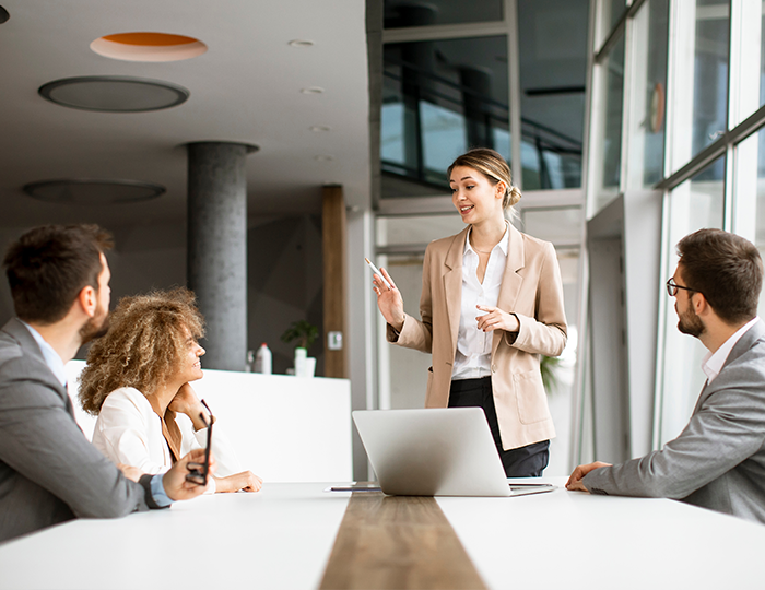 Female worker leading meeting in conference room