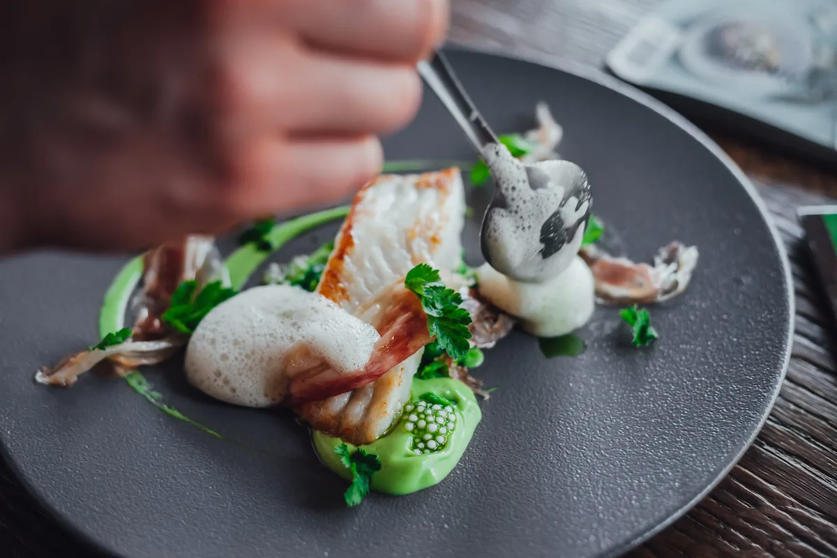 Fish food on plate  in michelin star restaurant