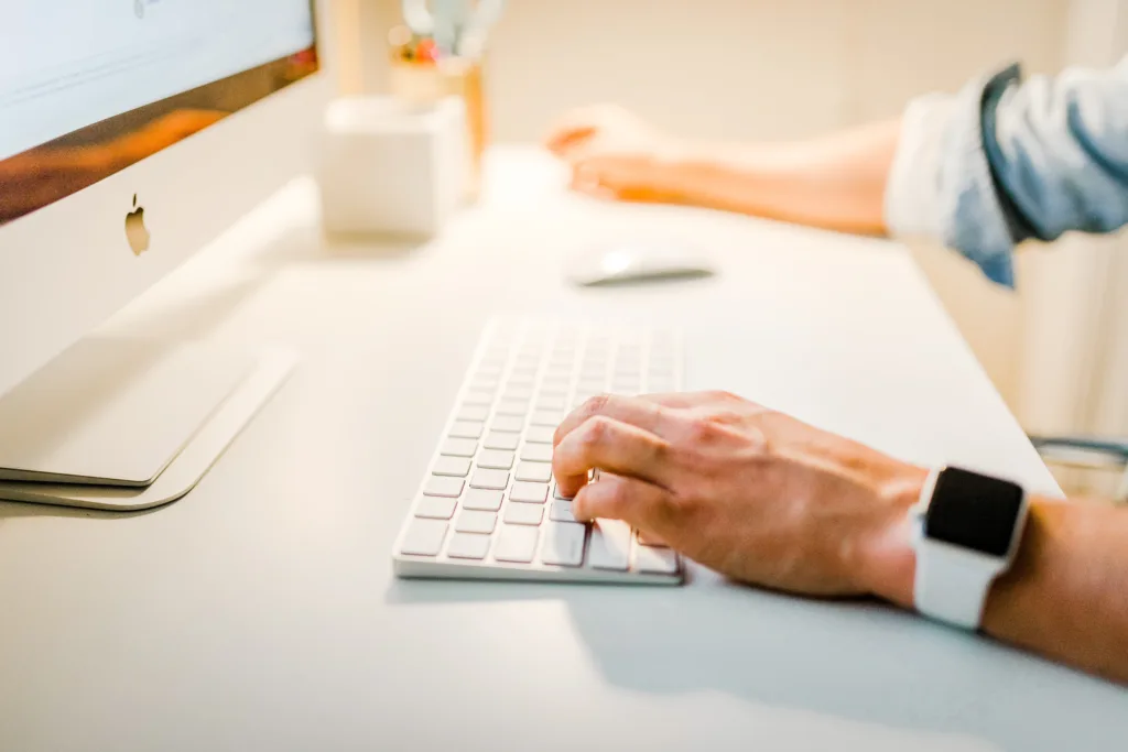 Person at computer sending emails