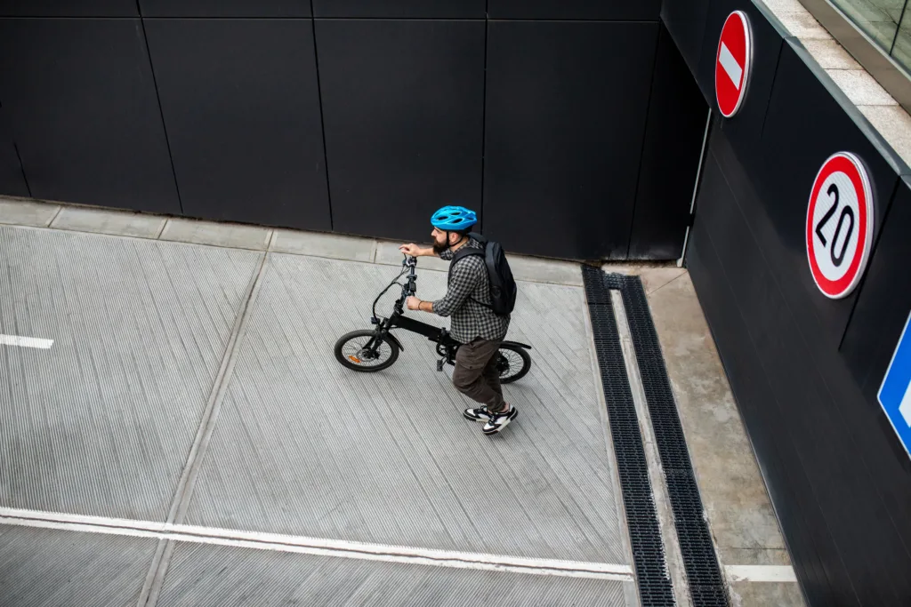 Casually clothed man on an electric bicycle